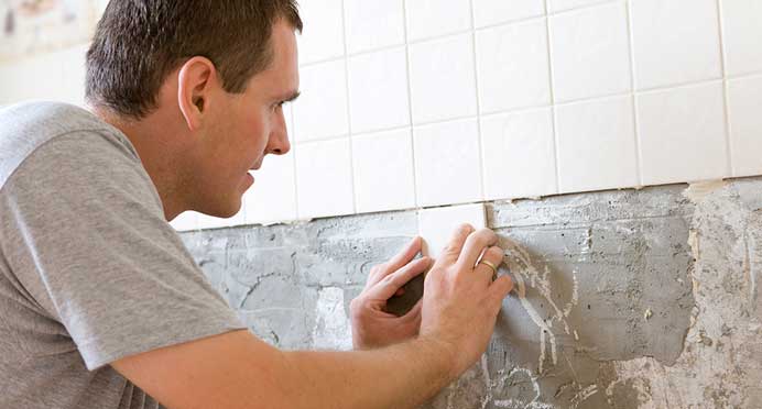 West Auckland Tiling Service Team Tiling a Bathroom